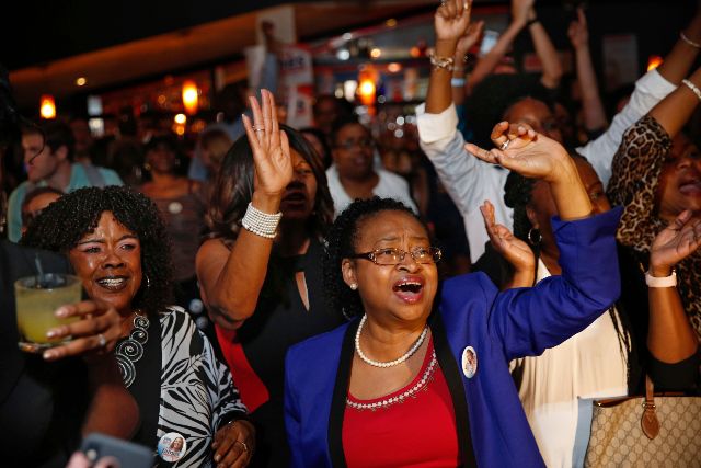 Supporters celebrate after the Democratic primary for attorney general was called in favor of Letitia James.